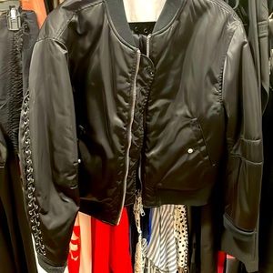 Black puffer jacket with detailing